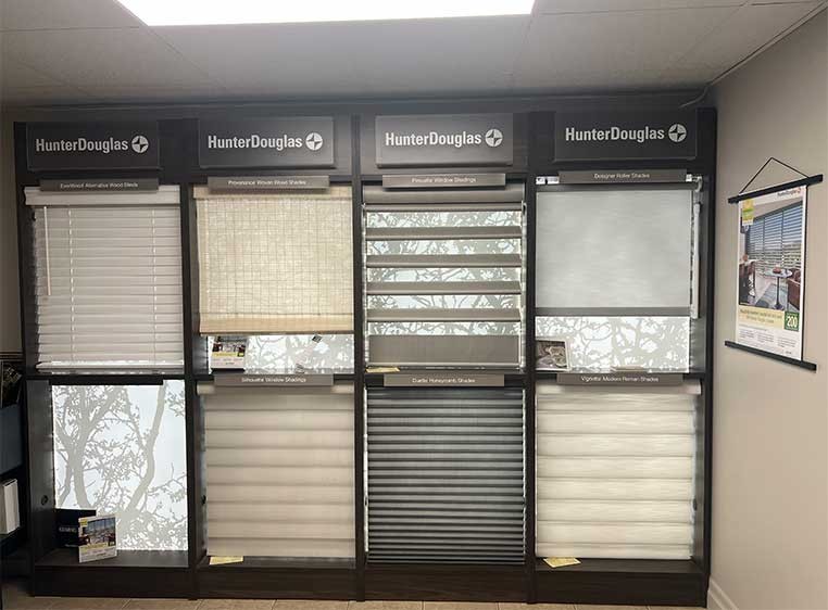 Store interior showcasing several different types of window coverings